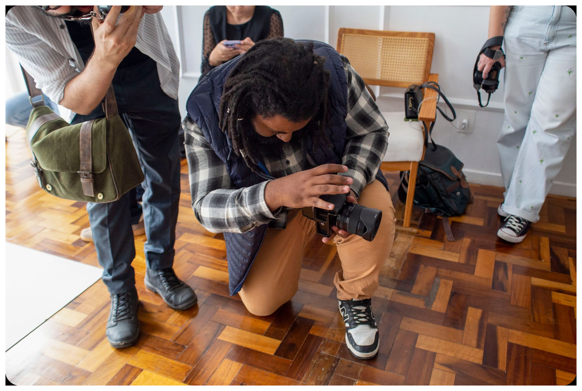 photographers capturing images with vintage film cameras studio setup professional photography workshop atmosphere creative workspace