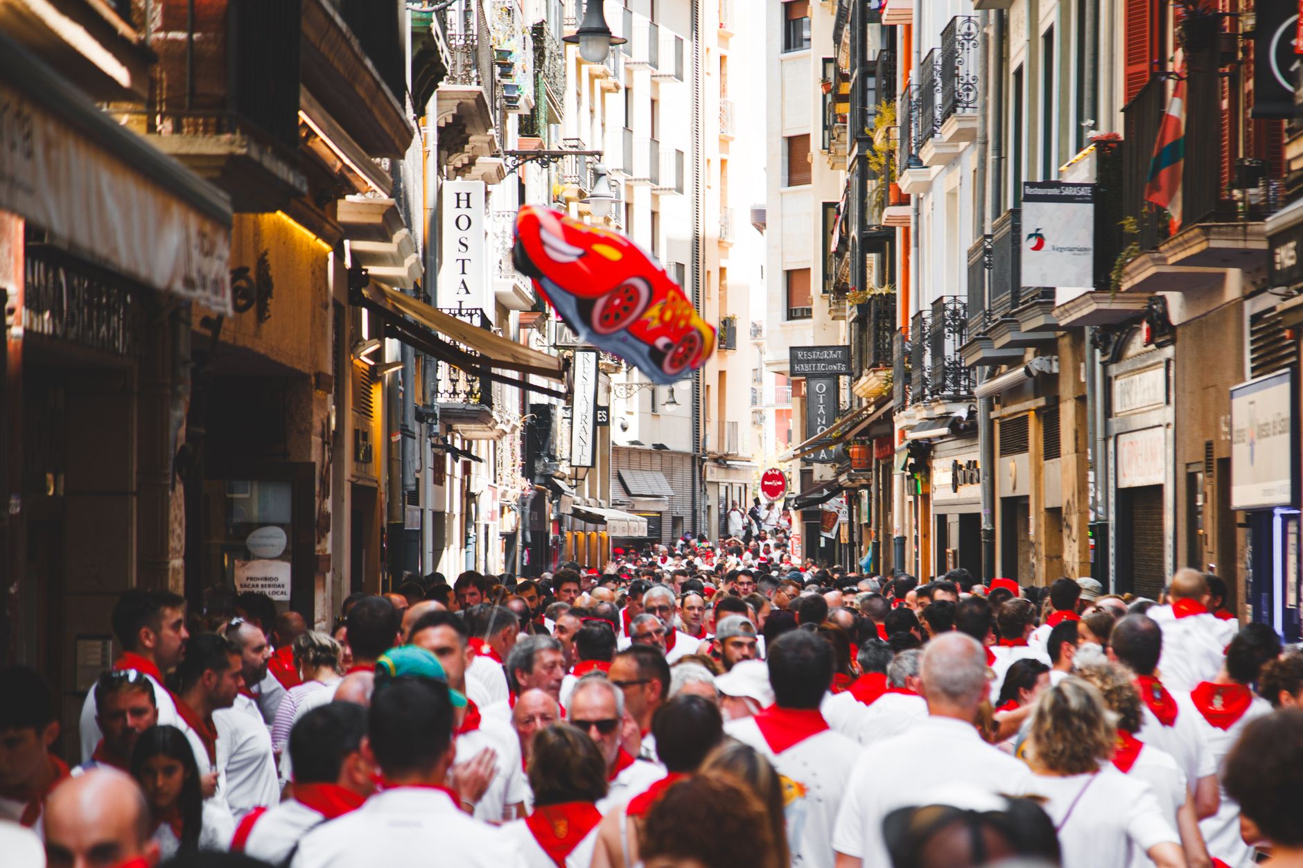 san fermin procession giant figures parade pamplona cathedral background celebration cultural heritage