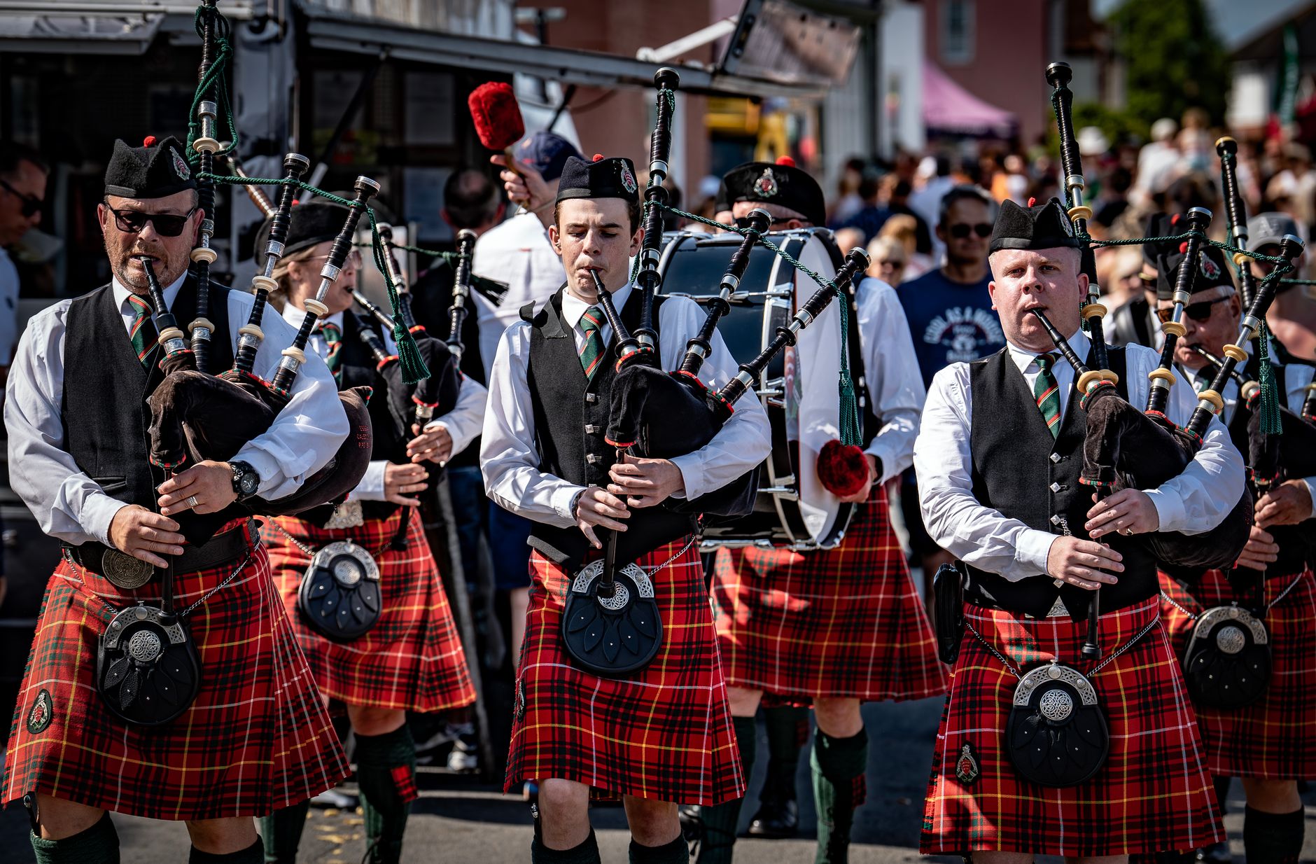 bagpipes gaita musicians parade traditional costumes leon village festival cultural celebration