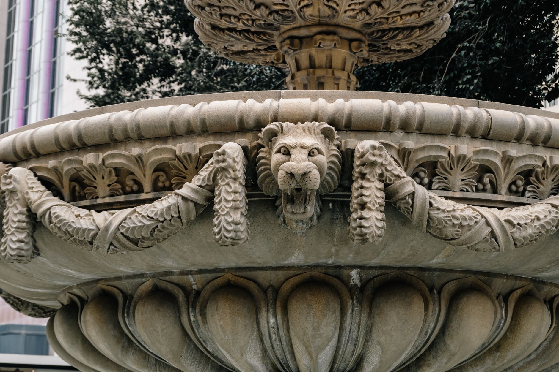 close-up stone lion sculpture fountain restoration detail workers