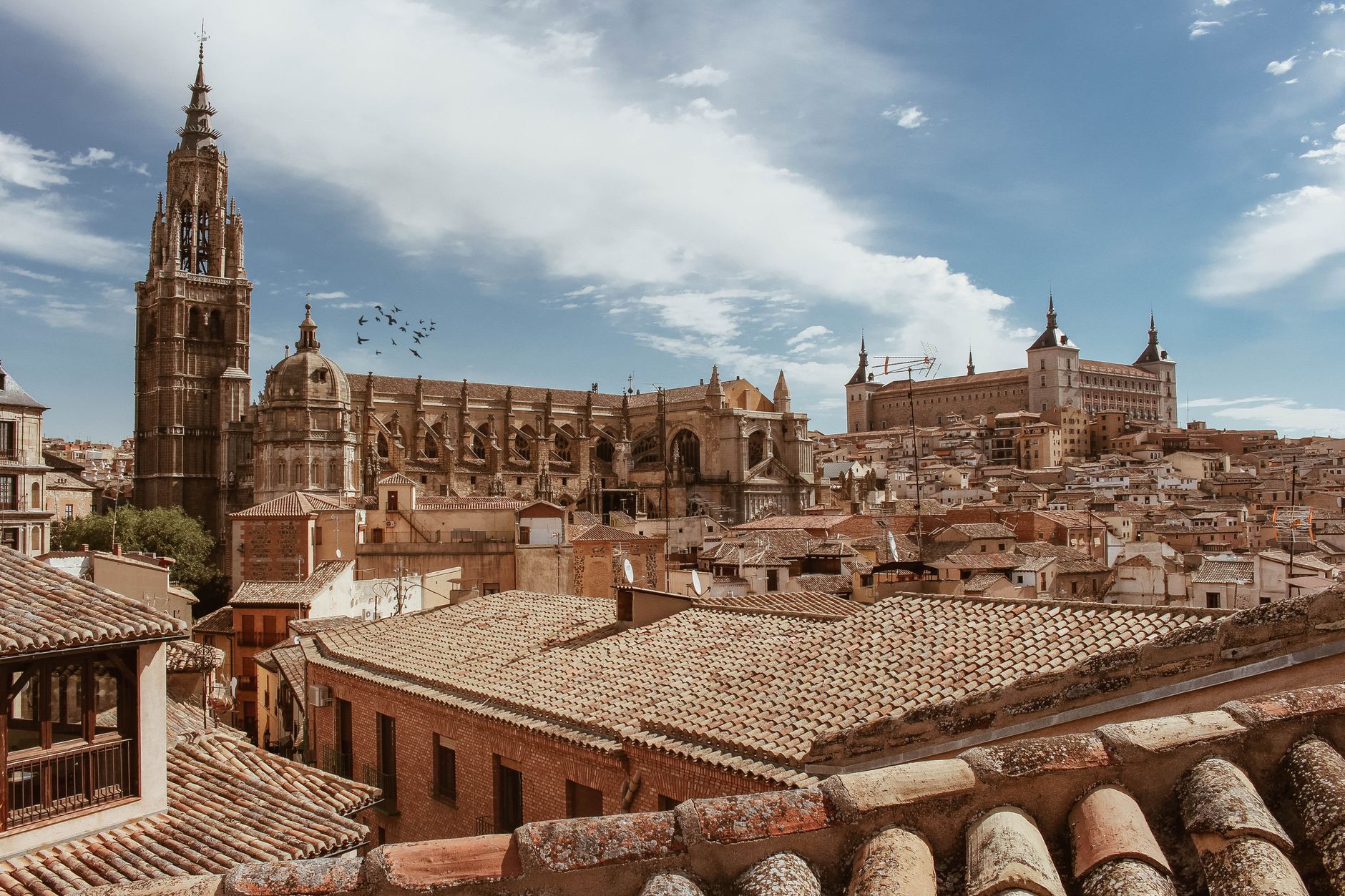 gothic cathedral facade toledo spain dramatic golden light stone towers