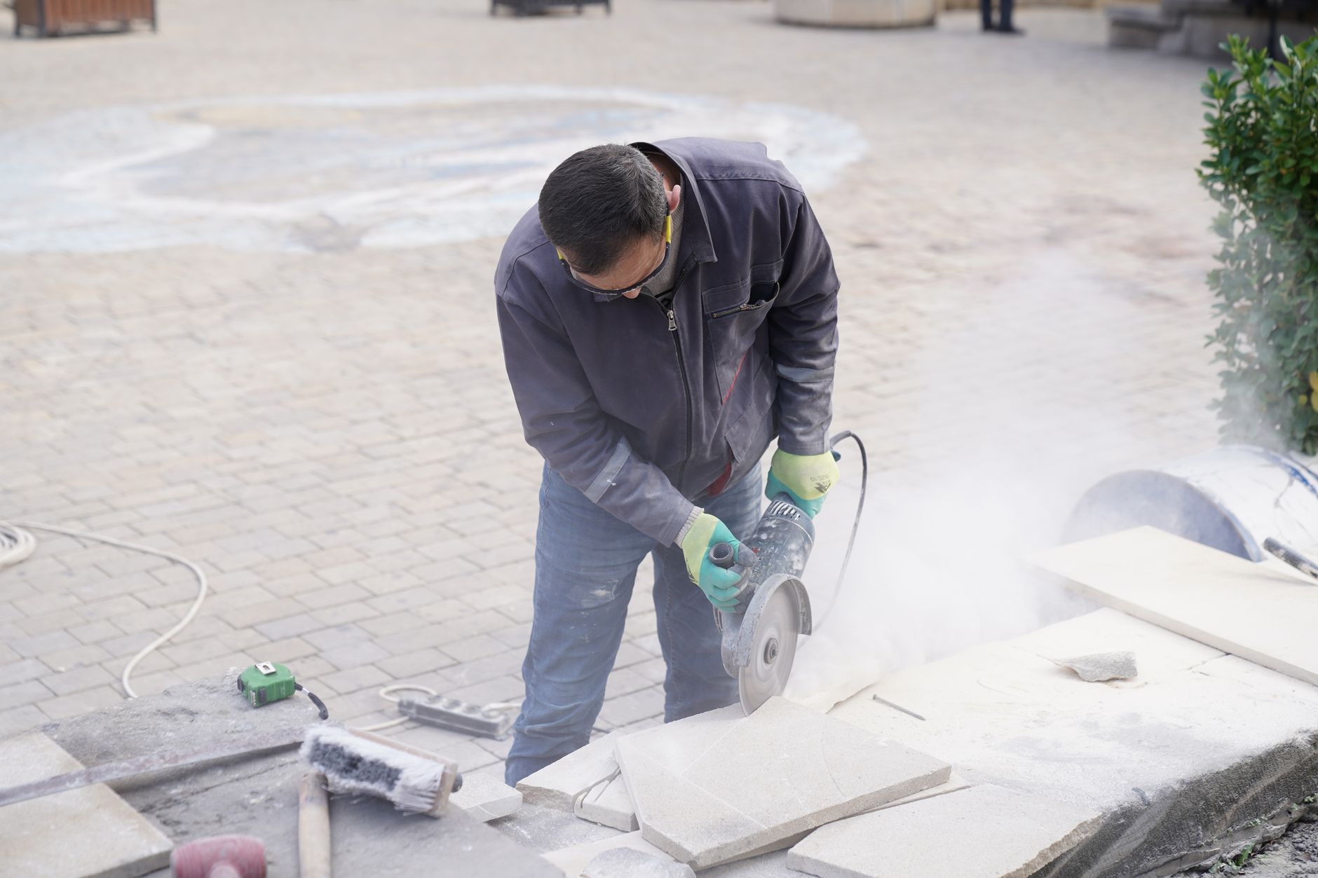 medieval stonemason placing foundation stone cathedral construction scene warm light
