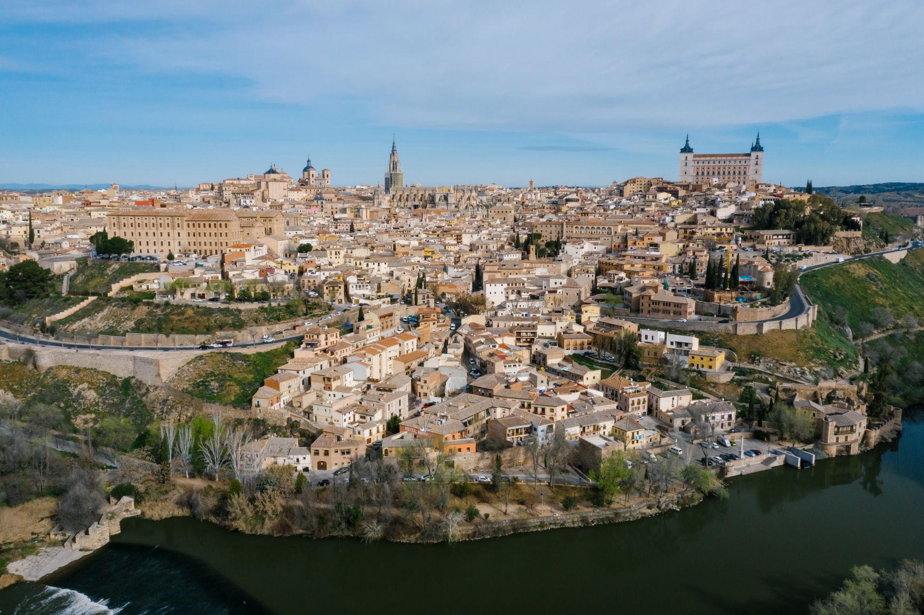 toledo medieval city landscape castle fortress overlooking tajo river historical capital spain golden light