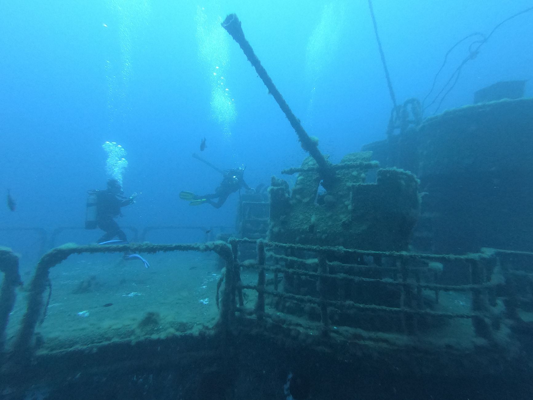 divers documenting roman amphorae shipwreck cargo underwater archaeology site